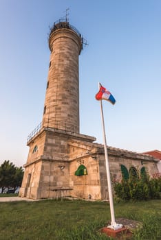 Savudija Lighthouse with Croatian Flag, the Most Western Point of the Balkans Peninsula and the Oldest Lighthouse in Croatia (Built 1818)