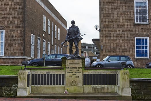 TUNBRIDGE WELLS, UK - JANUARY 26: Front shot of bronze War memorial depicting soldier holding rifle. January 26, 2016 in Tunbridge Wells.
