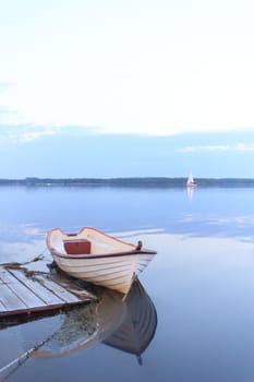 boat on the blue lake with cloudy sky, nature series