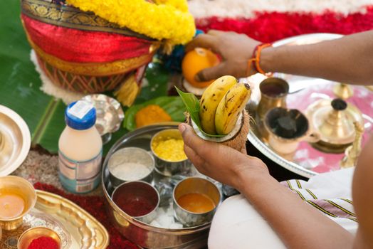 Traditional Indian Hindu religious praying items in ear piercing ceremony for children. Focus on the bananas. India special rituals heritage.