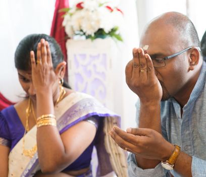 Couple received prayers from priest. Traditional Indian Hindus ear piercing ceremony. India special rituals.