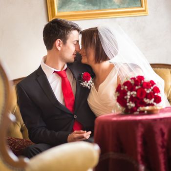 Bride and groom. Portrait of a loving wedding couple kissing.