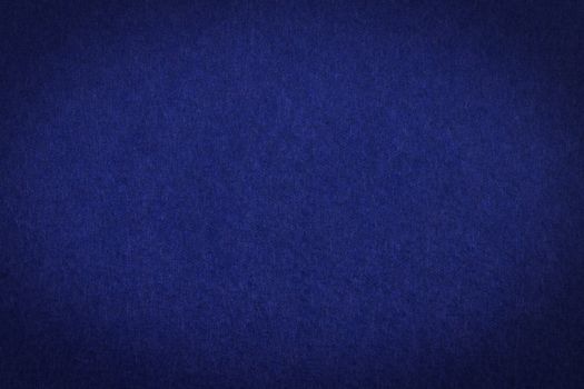 Dark blue paper with vignette, a background or texture