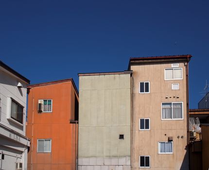 urban buildings against deep blue sky