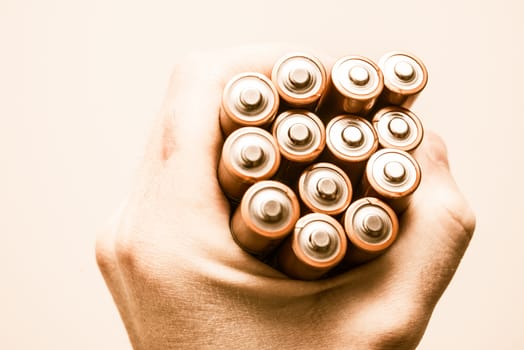 Batteries in the Hand. Mobile Power Supplies in the Male Hand. Power Concept.