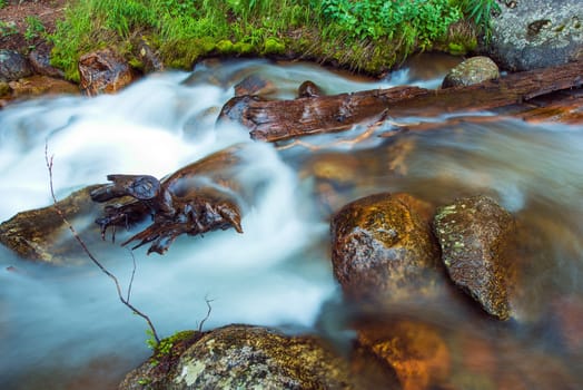 Clean Mountain River Closeup Photo. Rocky Mountain Stream.