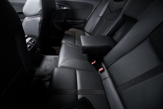 Luxury Rear Car Seats. Black Leather Car Interior Rear Seats. Studio Photo.