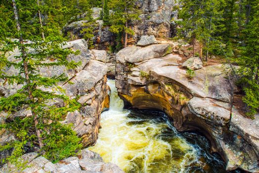 Mountain River Rush and Eroded Rock Formation. Colorado USA