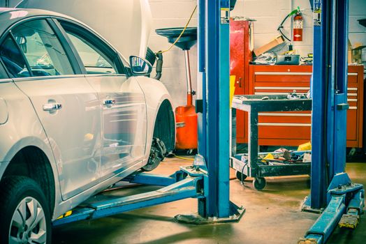 Car Servicing Station with Car Lift. Auto Service Interior.