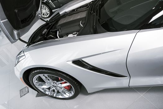 Brand New Silver Super Car For Sale Waiting For New Owner at Dealership. Cars Market Theme.