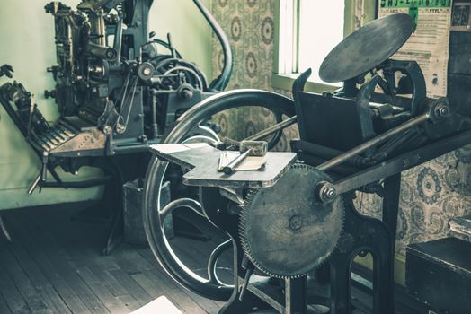 Vintage Printing Shop. Aged Newspaper Printing Equipment