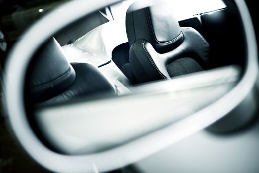 Car Seats in the Car Mirror. Driving Concept. Convertible Super Car Interior.