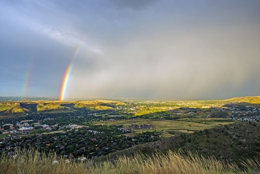 Denver Metro Rainbow. Beautiful Double Rainbow Above Golden, Colorado with Thunderstorm in a Distance. 