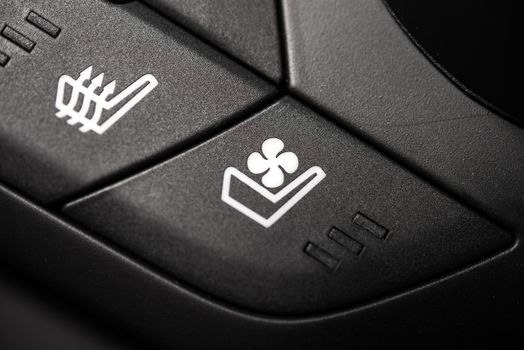 Heated and Ventilated Car Seat Controls. Heat and Ventilation Buttons Closeup