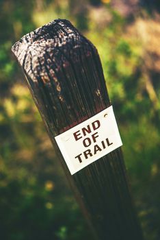 End of Trail Wooden Pole Sign Vertical Photo. Trail Finish. Hiking Theme.