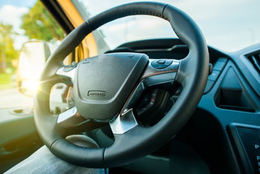 Modern Steering Wheel in a Van. Cargo Van Cockpit.