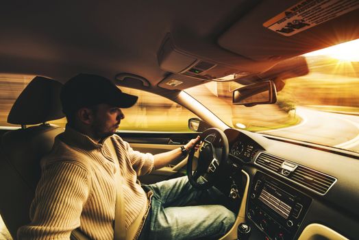 Fast Driving Car Interior Wide Angle Photography. Young Men After His 30 Driving Car Fast on the Curved Mountain Road.