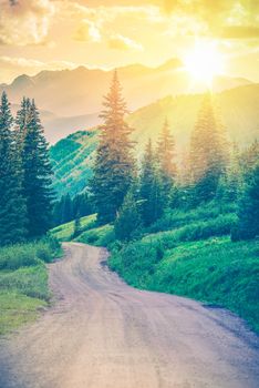 Scenic Mountain Road. Gravel Road Through Wonderful Colorado Landscape Scenery. Dream Road. Colorful Color Grading.
