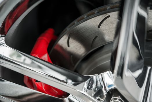 Super Car Brakes. Disc Brake. Disc Pads, Wheel Bearing, Caliper Assembly. Car Brakes Closeup Photo.