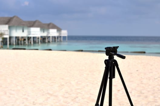 Tripod standing on maldives beach, equipment of couple lover travel, Maldives