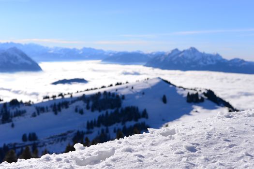 Close-up snow with the sea of clouds background; the Rigi Kulm in winter, Lucerne, Switzerland