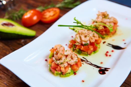 Salad with shrimps, tomato and avocado. Healthy food