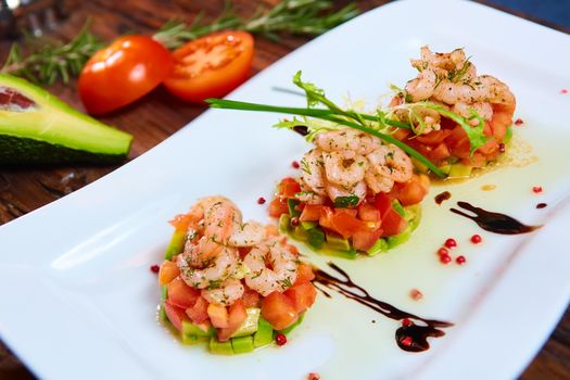 Salad with shrimps, tomato and avocado. Healthy food