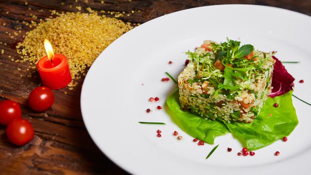 Salad with bulgur, parsley and vegetables. Selective focus