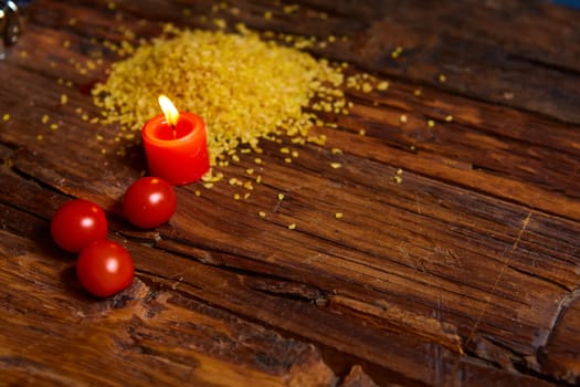 Raw Bulgur on wooden backgroundas detailed close-up shot