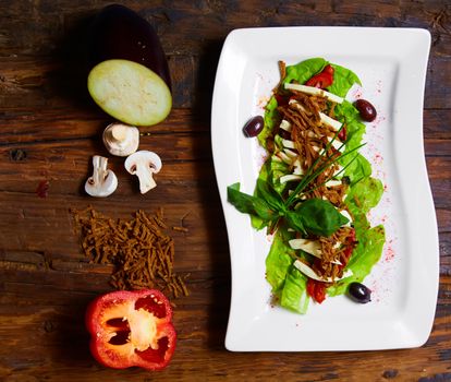 Salad from aubergine,mozzarella and tomato with basil. healthy food