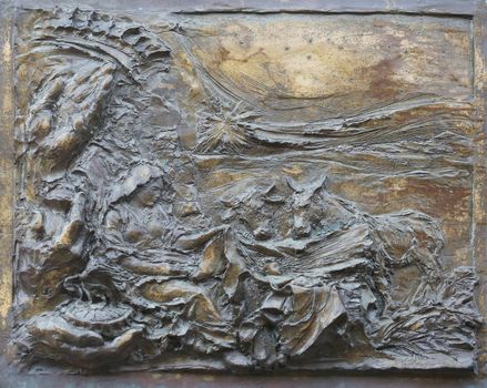 Birth of Jesus Christ, detail on the door of the church of St. James the Greater in Porto Azzurro, Elba, Italy