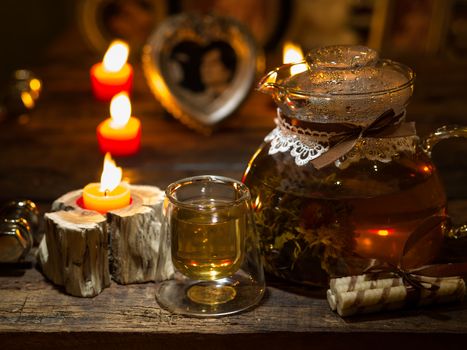 The exotic green tea with flowers in glass teapot  and cup
