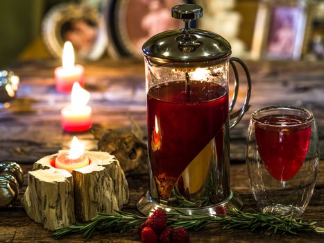 Red herbal and fruit tea in cup and tea pot