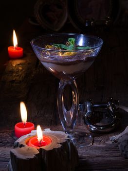 dessert with chocolate, cream and amaretti in glass