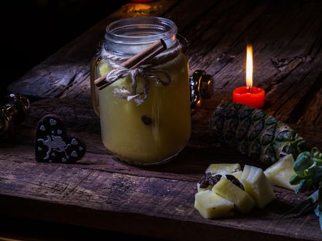 Concept green pineapple tea on wooden table