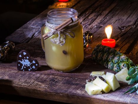 Concept green pineapple tea on wooden table