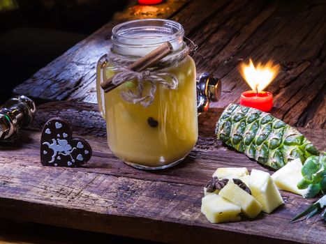 Concept green pineapple tea on wooden table