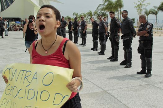 BRAZIL, Rio de Janeiro: A protester demonstrates against the genocide of black youths by police in front of the city's Museum of Tomorrow in Rio de Janeiro, Brazil on January 28, 2016. Protesters also cry out for the families who have been displaced in preparation of the Olympics.