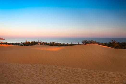 Red sand dunes in Mui Ne at sunset, Vietnam