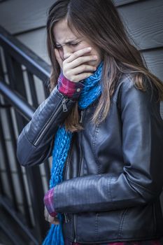 Distressed Young Crying Teen Aged Girl on Staircase.