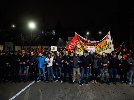 ITALY, Milan: Members of the Anti-Fascist Network of Milan march to protest against the meeting of Italian Secretary of the Northern League Matteo Salvini, French President of the National Front Marine Le Pen, and other officials at MiCo in Milan, Italy on January 28, 2016. Carrying pro-refugee signs, the protesters march through the city and launch fireworks.