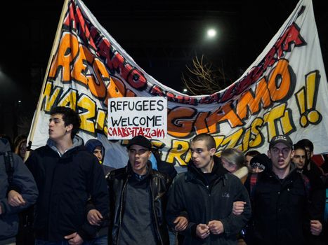 ITALY, Milan: Members of the Anti-Fascist Network of Milan march to protest against the meeting of Italian Secretary of the Northern League Matteo Salvini, French President of the National Front Marine Le Pen, and other officials at MiCo in Milan, Italy on January 28, 2016. Carrying pro-refugee signs, the protesters march through the city and launch fireworks.