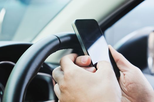 Image of using a mobile phone inside of a car