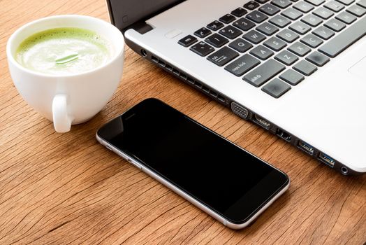 closeup black phone on desk