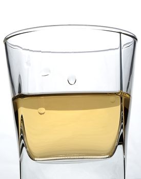 wet square glass with alcohol on white background