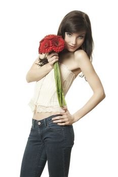 A beautyful woman with a bouquet of red gerbera