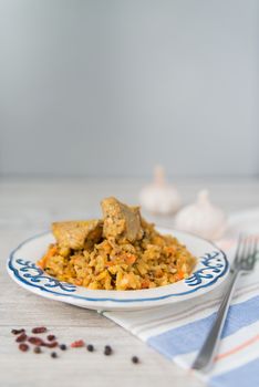 Plate of rice and meat national dish pilau with spices