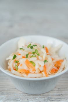 Plate of the sauerkraut with green onion