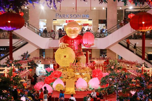 MALAYSIA, Kuala Lumpur: A picture is taken of the huge monkey installed in the middle of the Pavilion shopping centre in Kuala Lumpur, Malaysia for the Chinese Lunar New Year celebrations on January 29, 2016.  This year the Chinese New Year will be celebrated on February 8, 2016.  