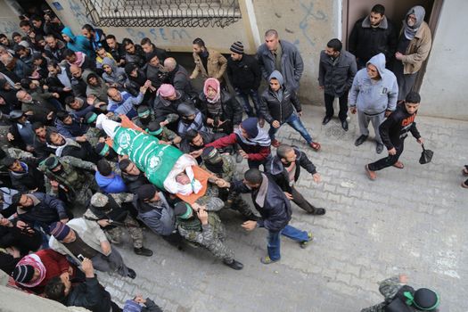 GAZA STRIP, Gaza City: Palestinian Hamas militants carry the body of one of the seven Hamas militants killed after a tunnel, built for fighting Israel, collapsed in the Gaza Strip, during their funeral in Gaza City on January 29, 2016.The Ezzedine Al-Qassam Brigades, Hamas's armed wing, said that four militants managed to escape after the collapse late on January 26 in the northeast of the strip.